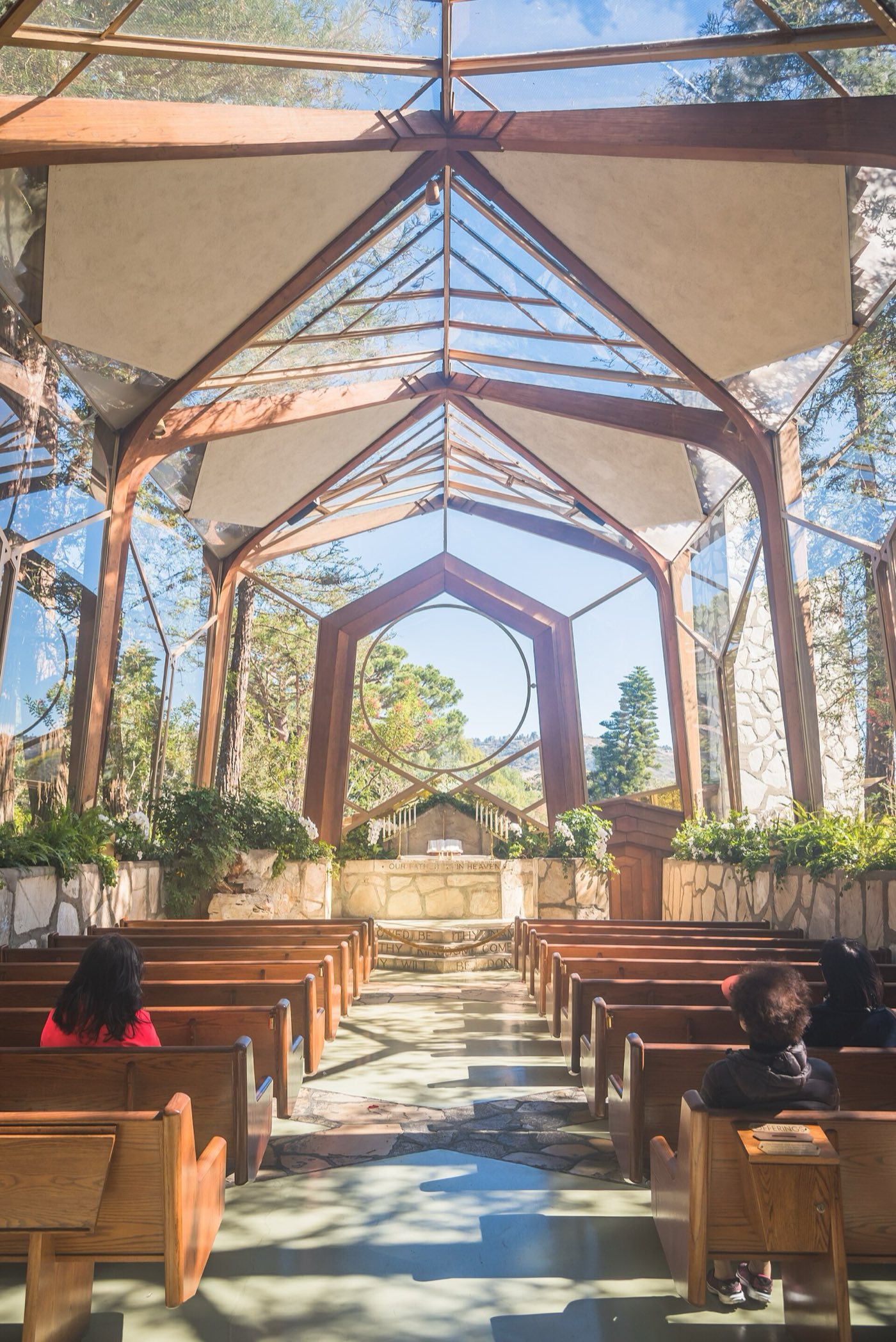 Interior of Wayfarers Chapel with glass walls and redwoods, before its 2024 dismantling